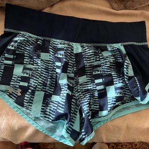 Under Armour, fitted medium running shorts. Lightly used.